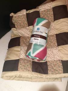 lot 1105 image: (2) Throws (1) quilted the other Brand new, plus a bed pillow
