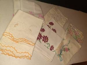 lot 1110 image: Hand embroidered pillow cases. Only one isnt a pair