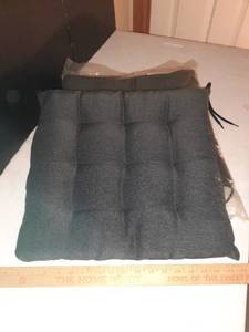 lot 1113 image: (2) Squared chair cushions. (1) New In Package
