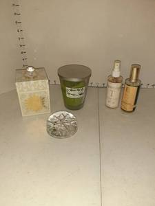 lot 1147 image: Candles, (2) bottles of room fragrance spray and a snowflake paper weight