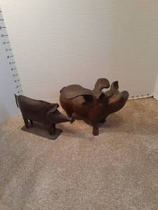 lot 1151 image: Resin pig with wings and a metal pig. Very cute