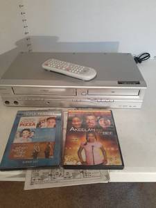 lot 1154 image: DVD player and VHS player with remote and (2) DVDs