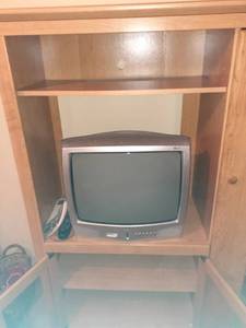 lot 1184 image: RCA television PLUS entertainment Center. 61 x 39 x 18