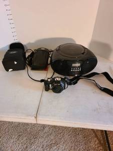 lot 2007 image: Sony Cyber shot, empty camera bags, Insignia CD player
