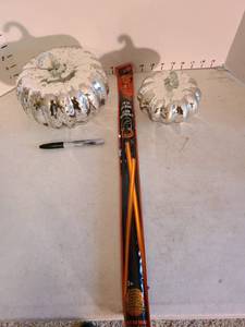 lot 2021 image: Two glass pumpkins and a glow necklace