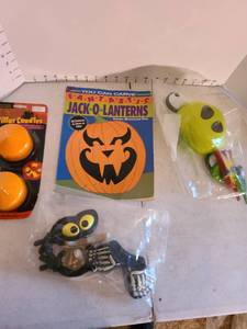 lot 2022 image: Jack-o-lantern designspattern book, plastic face inserts for pumpkins
