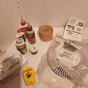 lot 2128 image: Whitcomb template for locating holes, stud finder, drain cover, seam tape and more