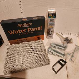 lot 2129 image: Aprilaire water panel evaporator NIB, anchoring adhesive and locks