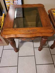 lot 2222 image: Beveled glass and wood end table 50 x 27 x 23. Matches lots 2220 and 2221.