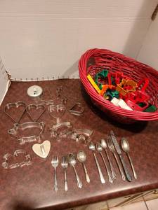 lot 2286 image: Red basket, cookie cutters, flatware