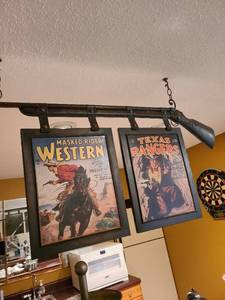 lot 2303 image: Hanging tin rifle with western signs overall appx. 41 wide and 23 tall
