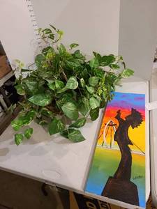 lot 3003 image: Keeper of the Plains oil on canvas 24 x 10, basket with greenery about 30 wide