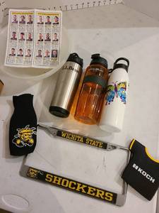 lot 3009 image: WSU Shockers license plate cover and koozies, team roster from 20172018, various cups