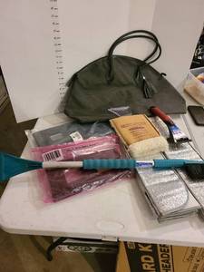 lot 3013 image: License plate covers, ice scrapers, sun reflectors and a large bag