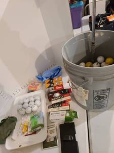 lot 3033 image: Golf balls and a golf club umbrella