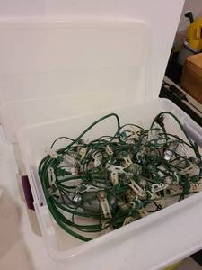 lot 3072 image: Storage tote with outdoor holiday lights, hooks, cord with timer
