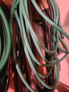 lot 4033 image: Two garden hoses black and green