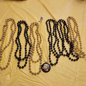 lot 1310 image: Black & gold beads, WSU bottlecap necklace