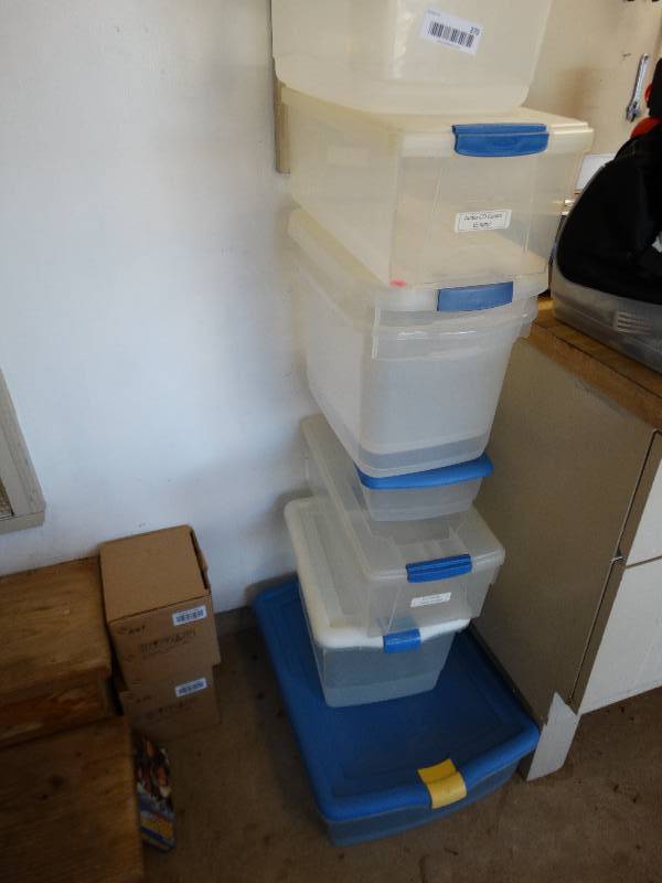 Stack of empty totes. West Wichita Estate Auction! Furniture