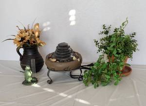 lot 169 image: Rock Fountain, Pitcher with Faux Flowers, Frog Rain Guage and Faux Greenery