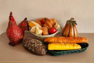 lot 199 image: Ceramic Pumpkin, Basket, Artificial Breads, Fruit and Cheese and Rustic Ceramic Rooster (see pics for repair)