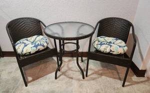 lot 219 image: Outdoor Patio Table and 2 Chairs with Cushions - 28 Diameter - Used Indoors