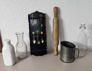 lot 251 image: Collectible Spoons on Wall Rack, Vintage Milk Bottles, Rolling Pin and Flour Sifter