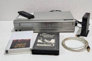 lot 263 image: Memorex DVD & VHS Player Model EWD2204 with Remote and VHS Tapes