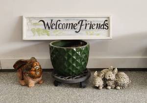 lot 485 image: Garden Decor - Rabbits, Planter, Rolling Base and Sign