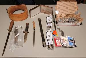 lot 302 image: Knives, Sharpener, Gun Locks, Leather Brace, Cards and Freedom Coins
