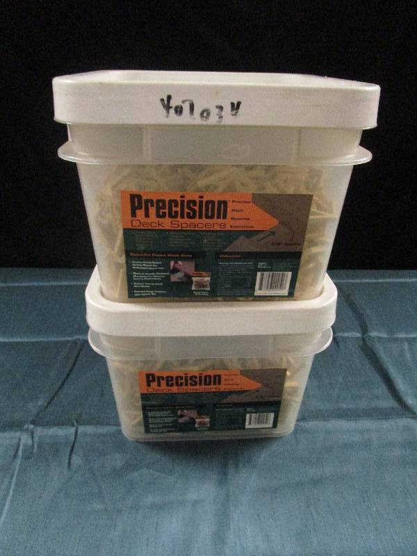 lot 1032 image: Two buckets of new Precision deck spacers