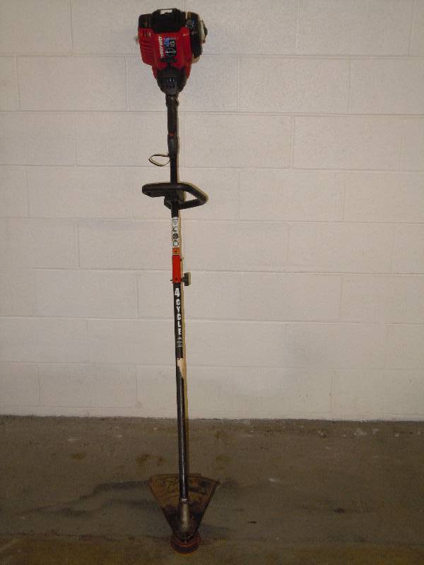 lot 174 image: Troy-Bilt weed eater