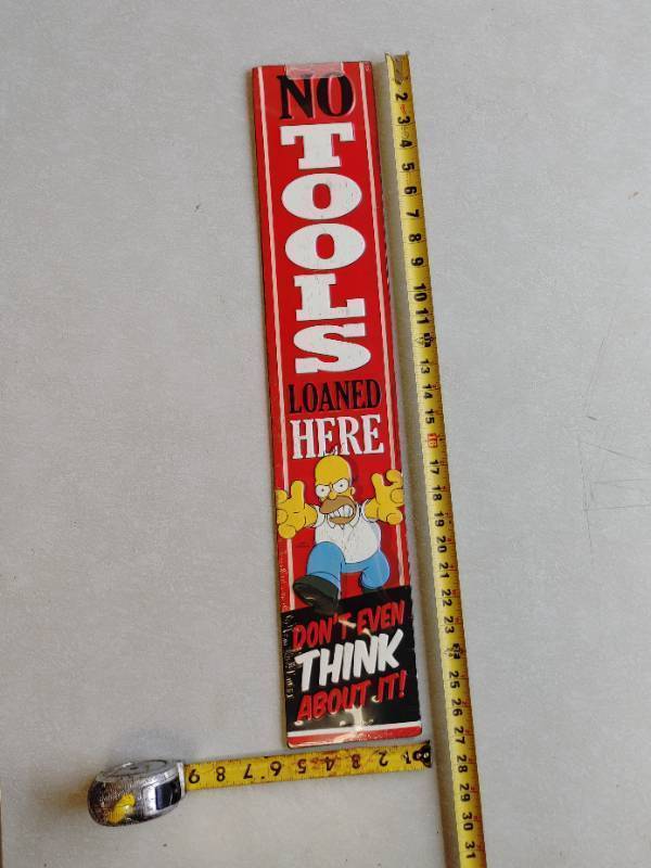 lot 7 image: Homer - No tools loaned tin sign