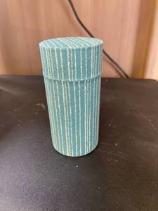 lot 376 image: Fabric Covered Tin Tea Container - 5 oz.