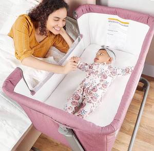 lot 28176 image: Dream On Me Seashell Bassinet &amp Bedside Sleeper in Rose, Lightweight Easy Folding and Height Adjustable Baby Bassinet, Mattress Pad Included, JPMA Certified
