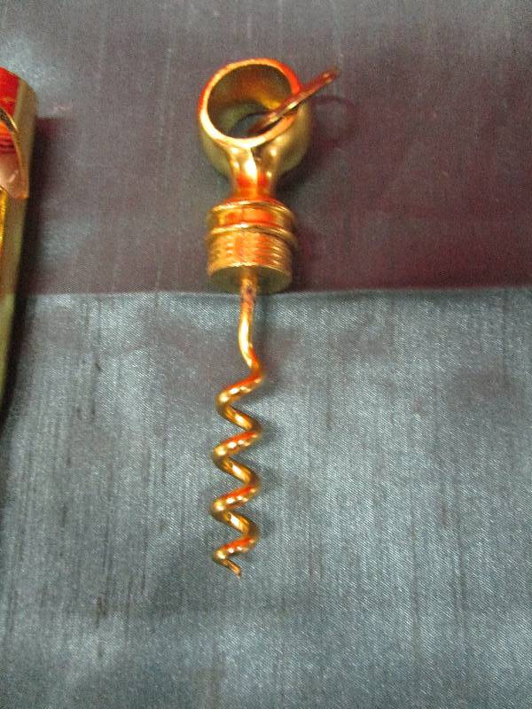 lot 8224 image: Brass Round faux wine bottle opener