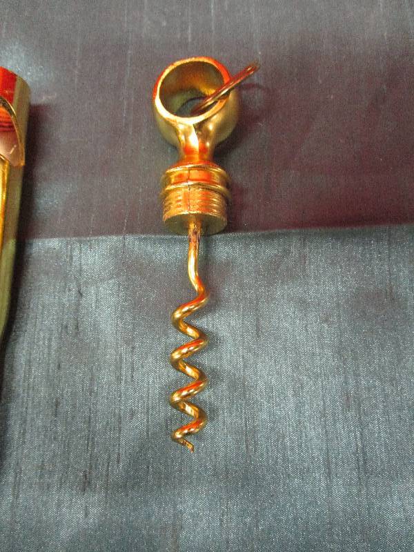 lot 8225 image: Brass Round faux wine bottle opener