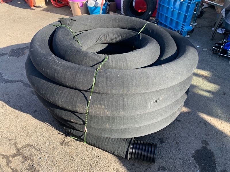 lot 168 image: New 100ft Role of Drain Tubing (4-12 Wide)