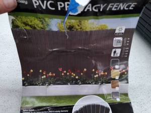 lot 67273 image: Sekey PVC privacy fence, unknown size and amount, used, some pieces are damaged