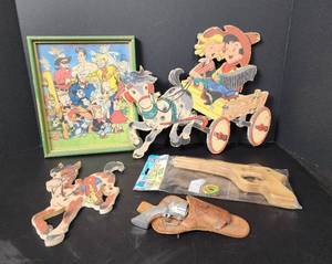 lot 188 image: Vintage Toy Gun and Leather Holster, New Rubberband Gun, Cowboy and Indian Pin-ups, and More