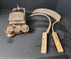 lot 108 image: (2) Vintage Barn Door Hangers and (2) Farm Tools