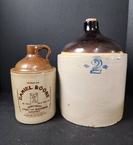 lot 109 image: #2 Crock Jug (see pics for damage) and Crock Daniel Boone Whiskey Jug