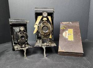 lot 136 image: Vintage Rainbow Hawkeye #2 Folding Model C Kodak Camera by Eastman Kodak, Vintage #3A Folding Autographic Brownie Camera, and Vintage The Cine Titler Pocket Model #1