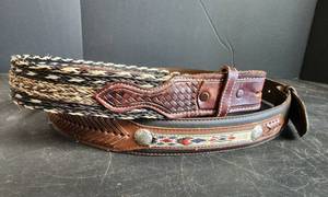 lot 25 image: (2) New Belts (1) is Horsehair size 34 and other is Size 42