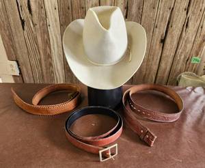 lot 315 image: Cowboy Hat Size 6 34 and (3) Leather Belts Size 32, 34, and 48