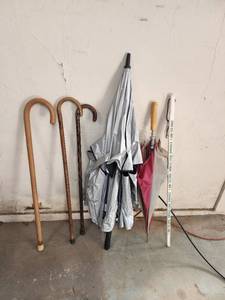 lot 67 image: Umbrellas, Canes, and Square Yard Stick