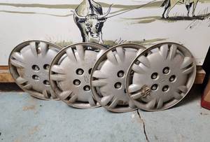 lot 401 image: (4) Chevy 5 Lug Wheel Covers (see pics for damage)