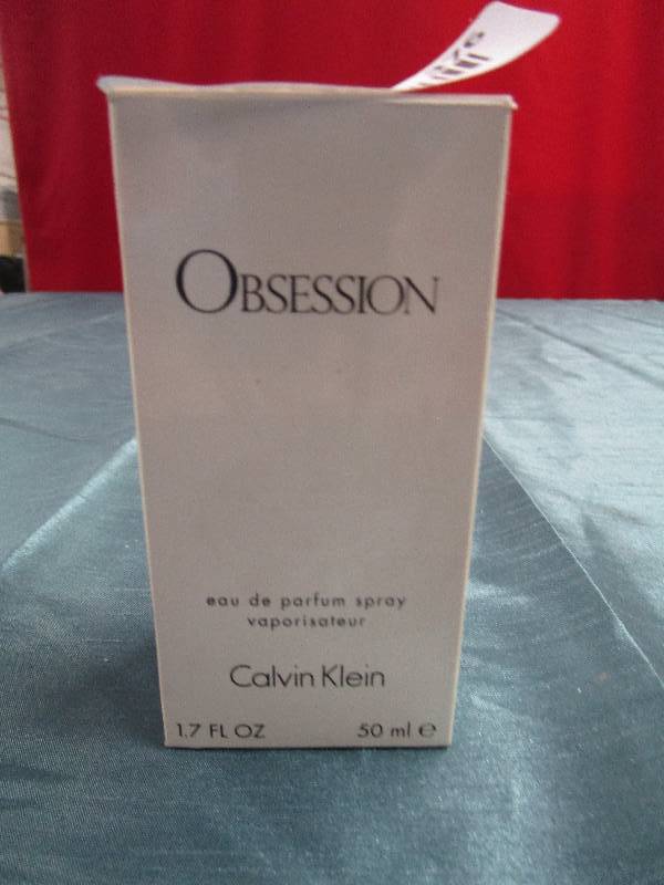 lot 376 image: Obsession perfume spray