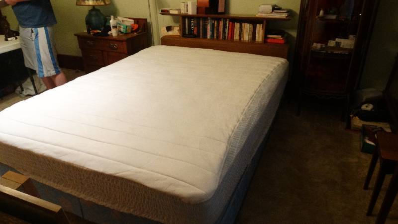 lot 861 image: Full sized bed, wbookshelf head board no contents.