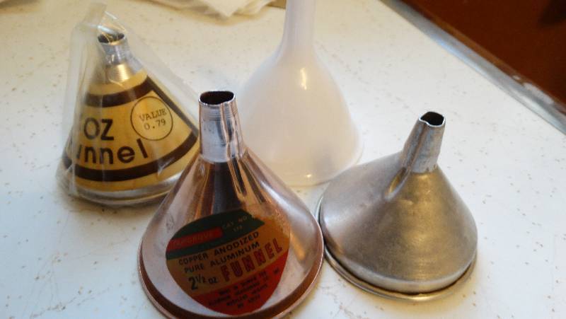 lot 973 image: 4 Kitchen funnels.